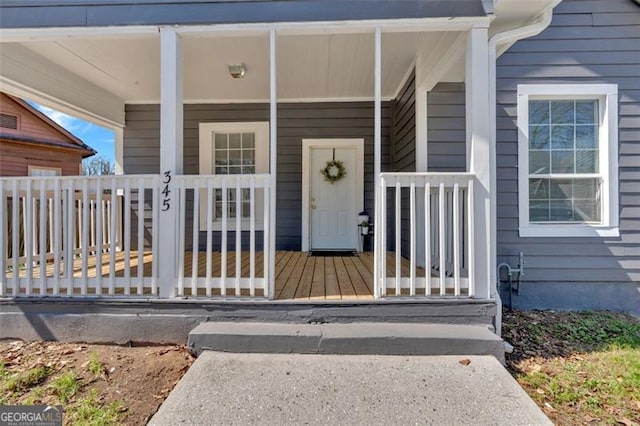 property entrance with covered porch