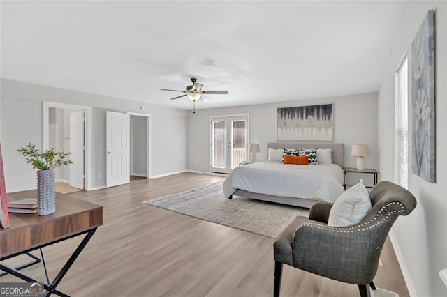 bedroom with wood finished floors, baseboards, and ceiling fan