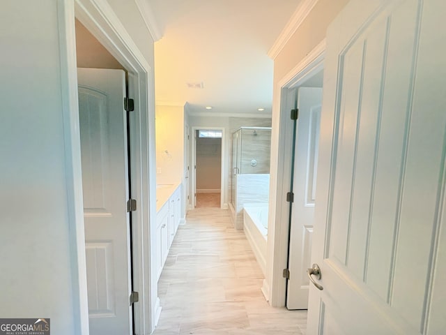 corridor with visible vents, recessed lighting, and crown molding