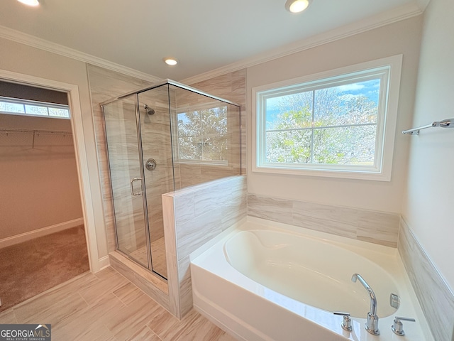 full bath with a bath, a stall shower, a spacious closet, and crown molding