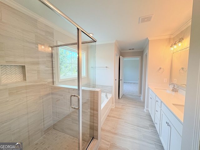 full bath with visible vents, ornamental molding, a sink, a shower stall, and a bath