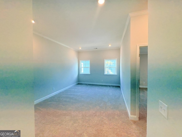 unfurnished room with carpet flooring, baseboards, and ornamental molding