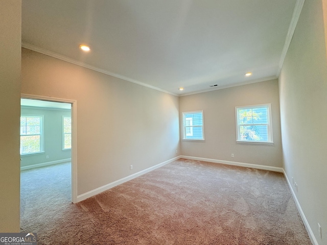 carpeted spare room featuring recessed lighting, baseboards, and ornamental molding