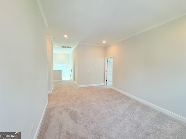 empty room featuring visible vents, baseboards, ornamental molding, light carpet, and recessed lighting