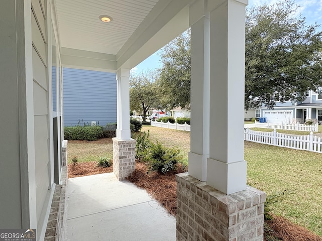 view of patio / terrace with covered porch and fence