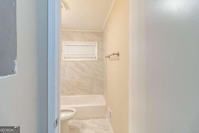 full bath with visible vents, toilet, marble finish floor, a textured ceiling, and crown molding