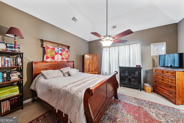 bedroom with visible vents, carpet, and vaulted ceiling