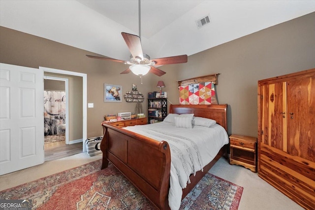 bedroom with visible vents, lofted ceiling, carpet floors, and a ceiling fan