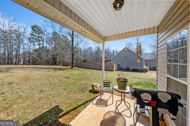 view of yard featuring a patio and fence