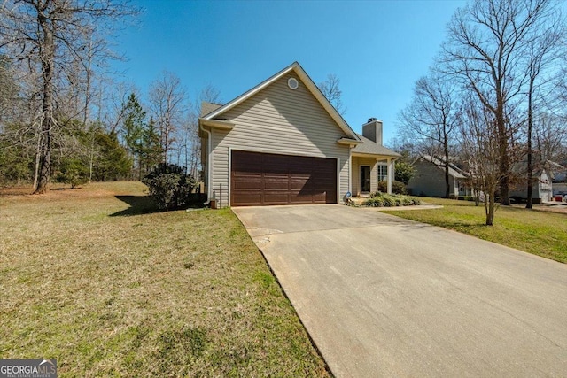 view of front facade with a garage, a front lawn, a chimney, and driveway