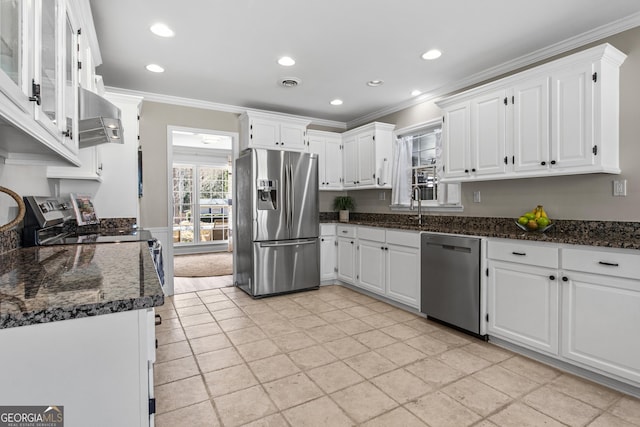 kitchen with crown molding, white cabinets, visible vents, and appliances with stainless steel finishes