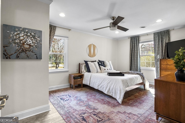 bedroom featuring recessed lighting, wood finished floors, visible vents, and baseboards