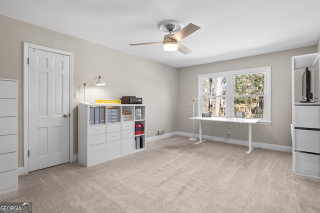 interior space featuring a ceiling fan and baseboards