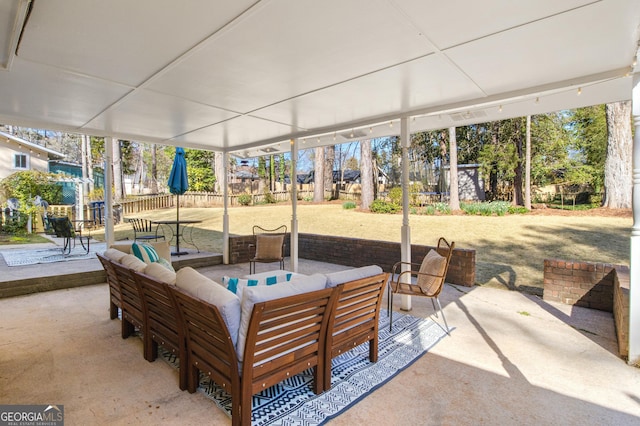 view of patio / terrace with fence and an outdoor hangout area