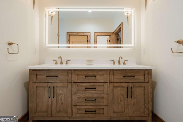 bathroom featuring double vanity and a sink