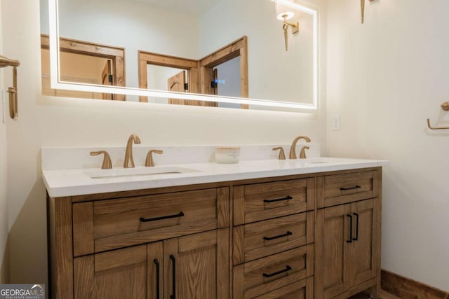 full bathroom with a sink and double vanity