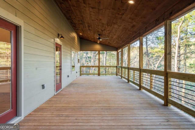 wooden terrace featuring a ceiling fan and covered porch