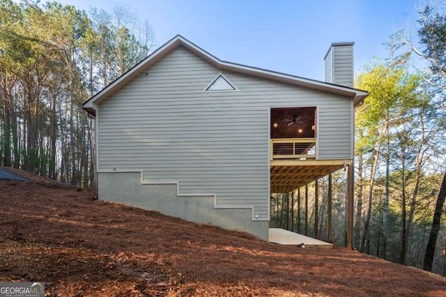 view of side of property with a chimney