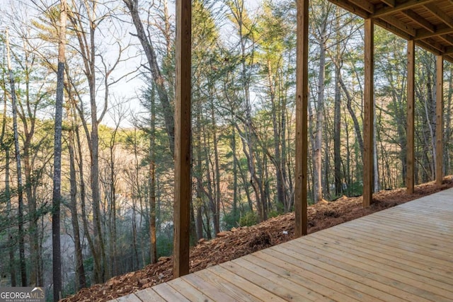 deck featuring a wooded view