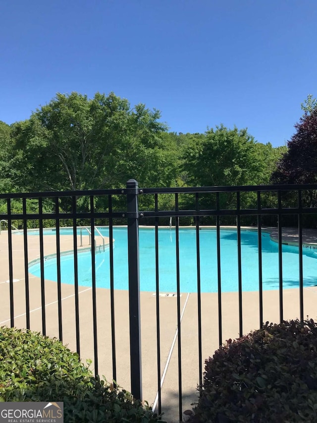 community pool with fence