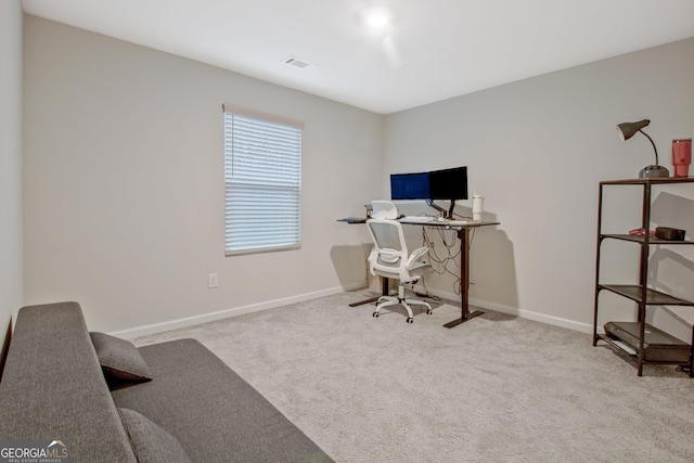 office area featuring visible vents, carpet floors, and baseboards