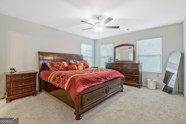 bedroom with visible vents, ceiling fan, carpet, and baseboards