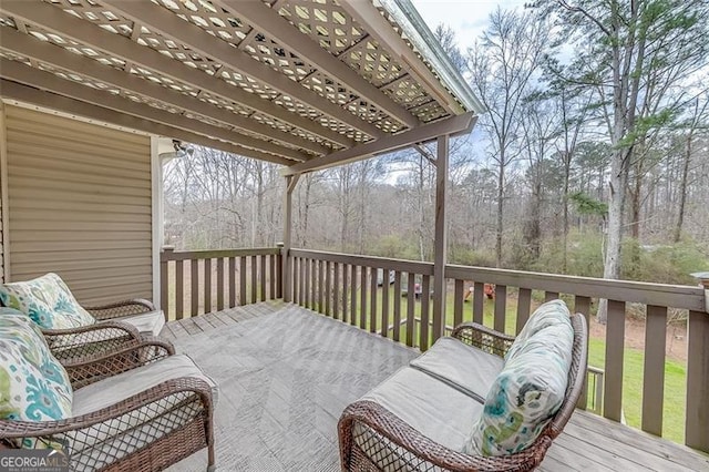 wooden deck featuring an outdoor living space and a pergola