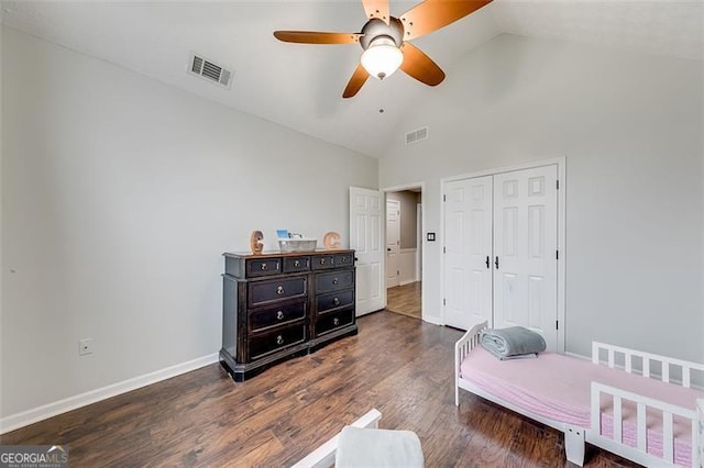 bedroom featuring a closet, visible vents, baseboards, and wood finished floors