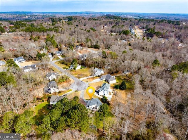 birds eye view of property with a forest view