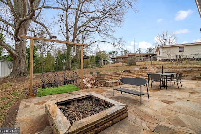 view of patio / terrace with outdoor dining area and fence