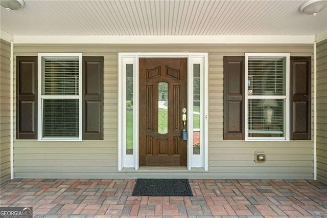 doorway to property featuring a porch