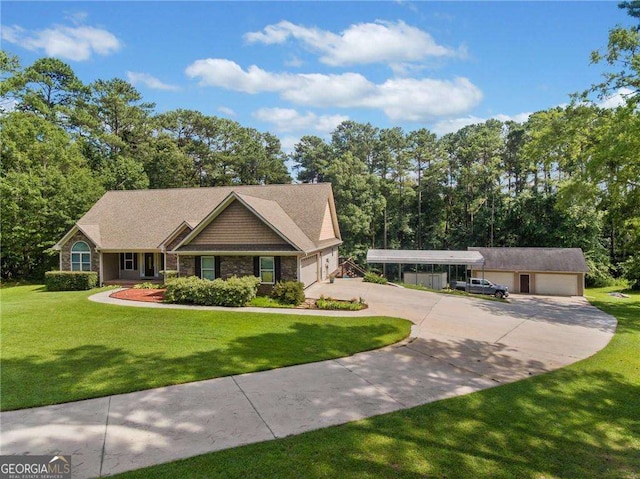 view of front of home featuring concrete driveway and a front yard