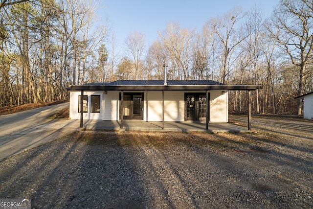 view of front of house featuring metal roof