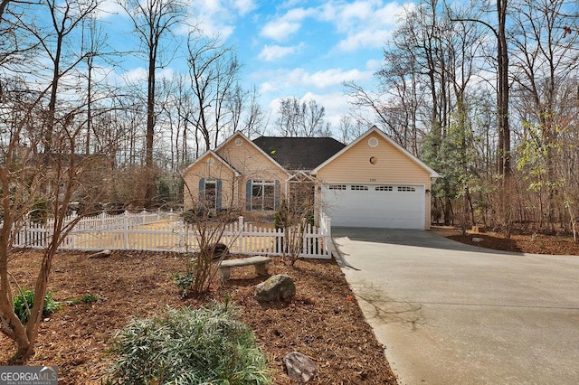 view of front of home featuring brick siding, concrete driveway, fence, and a garage