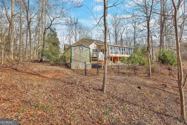 view of yard featuring a deck and fence