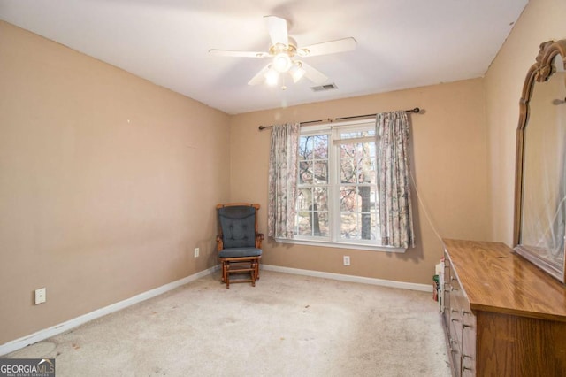 unfurnished room featuring carpet flooring, baseboards, visible vents, and ceiling fan