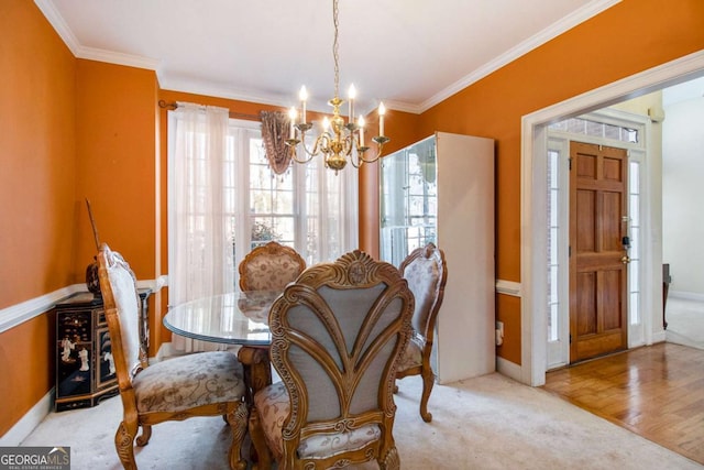 dining area featuring carpet flooring, crown molding, and a notable chandelier