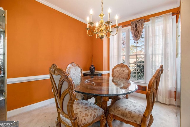 dining room featuring visible vents, ornamental molding, carpet flooring, baseboards, and a chandelier