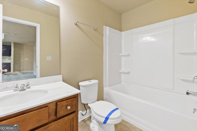 bathroom with shower / bathing tub combination, toilet, and vanity