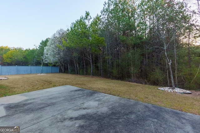 view of yard with a patio and fence