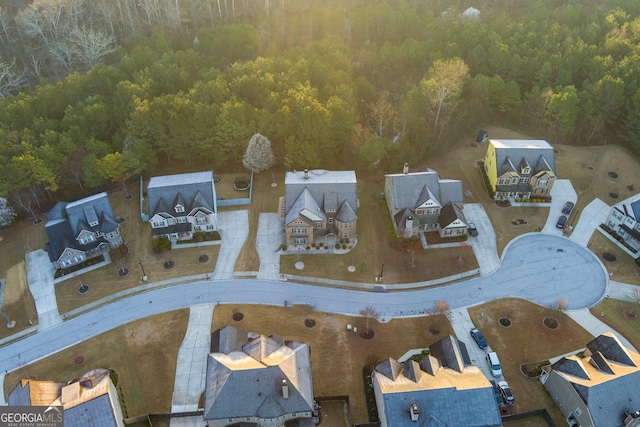 bird's eye view featuring a forest view and a residential view