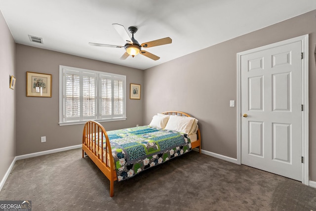 carpeted bedroom featuring visible vents, baseboards, and a ceiling fan