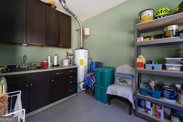 interior space featuring water heater and a sink