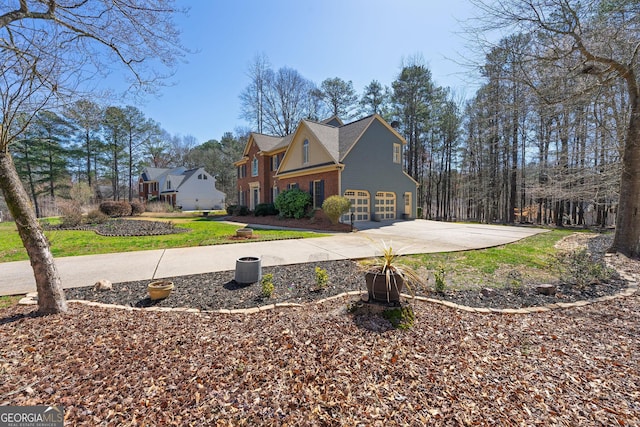 view of home's exterior featuring an attached garage, a lawn, brick siding, and driveway