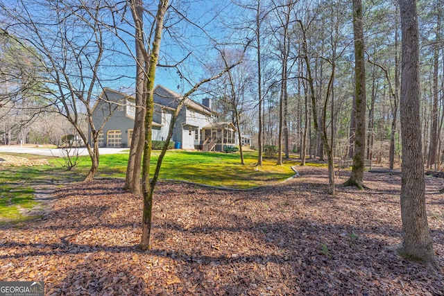 view of yard with a sunroom