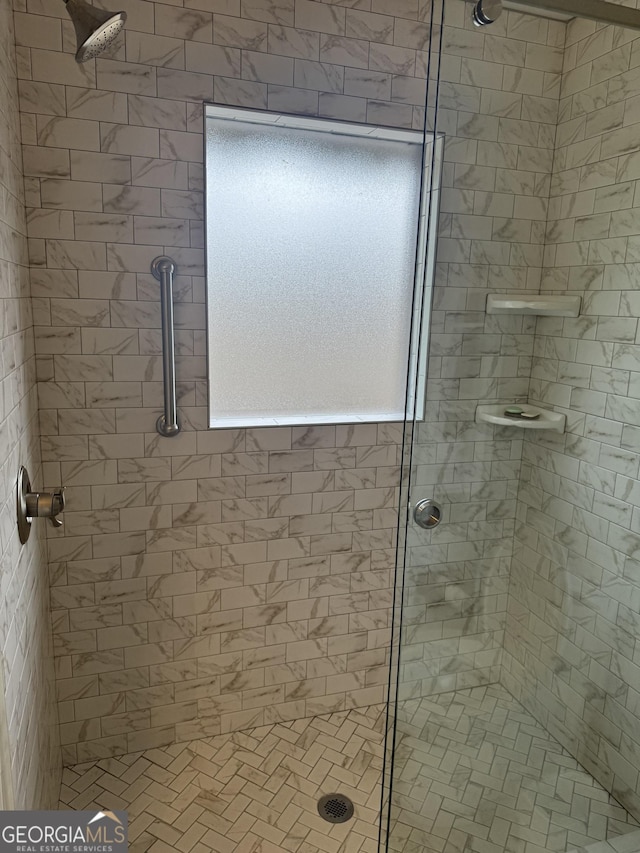 bathroom with a shower stall