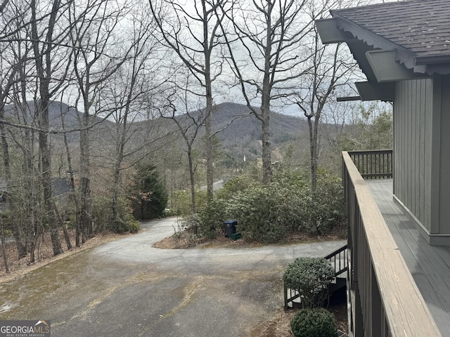 63 Mashie Ln, Sky Valley, GA 30537 - view of yard with a mountain view, stairs, and asphalt driveway