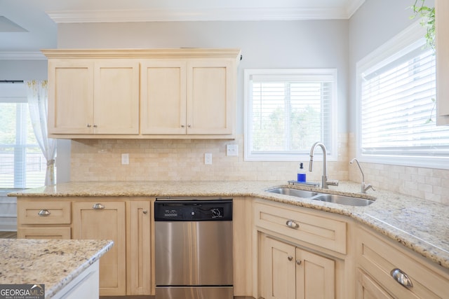 kitchen featuring a sink, a wealth of natural light, dishwasher, and ornamental molding