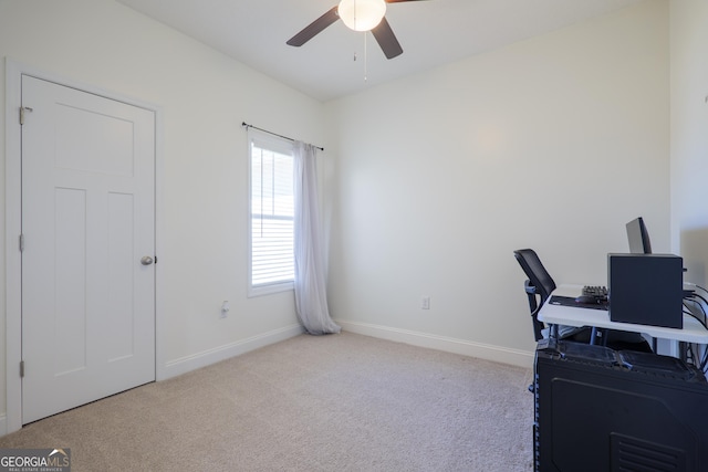 office area featuring ceiling fan, baseboards, and carpet