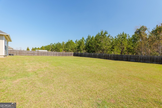 view of yard featuring a fenced backyard